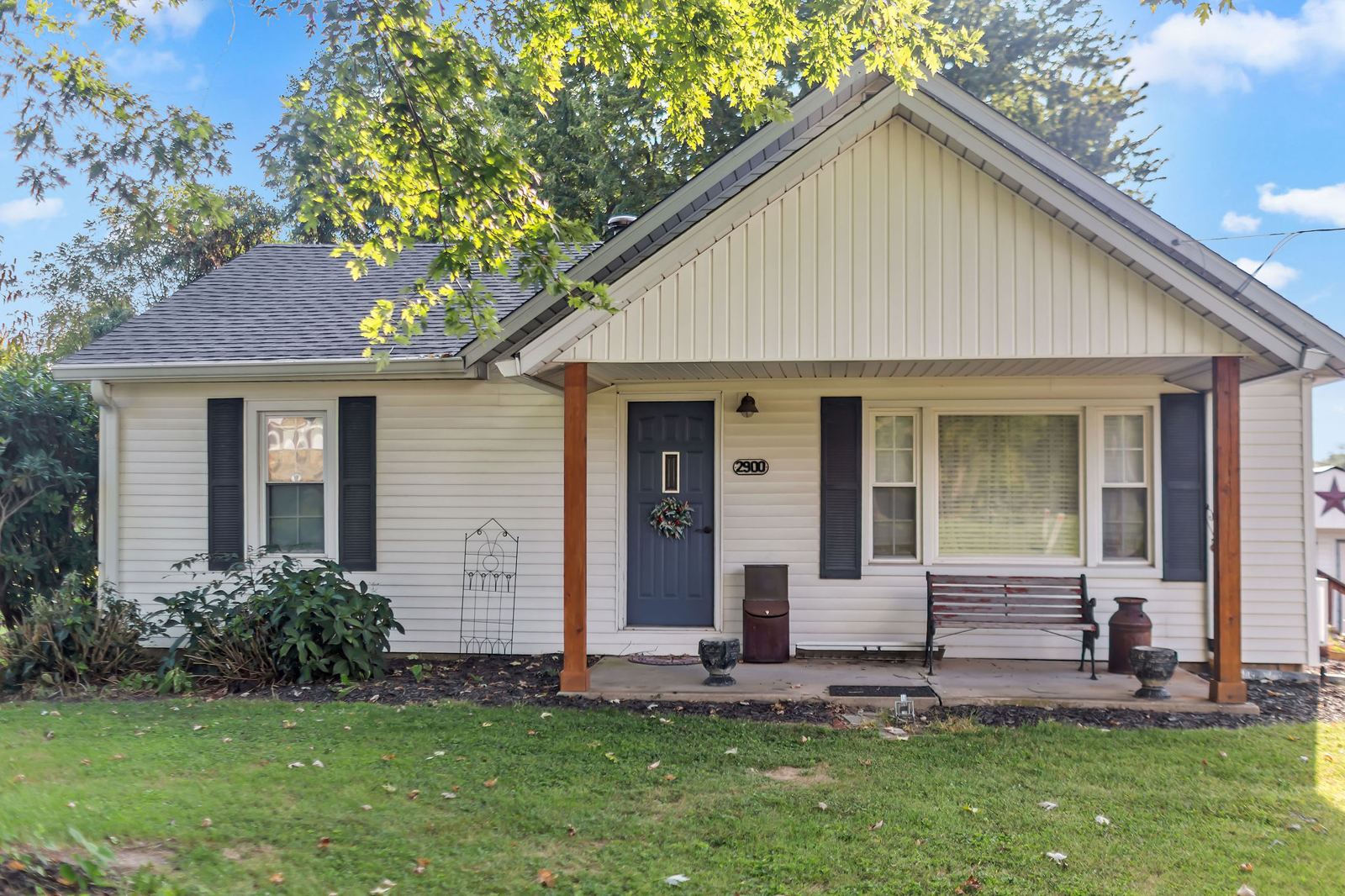 Front of 2900 N Smith Pike with a covered front porch and a wide lawn